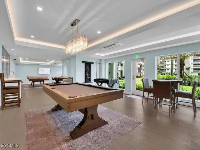 a room with lots of furniture and a table