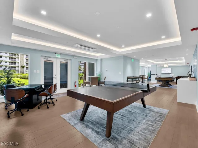 a room with furniture and a pool table
