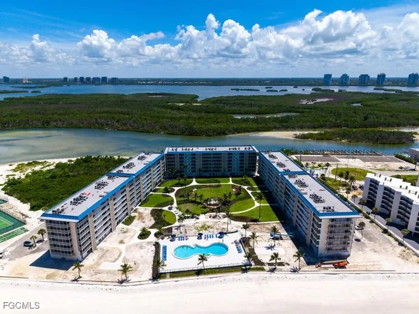 an aerial view of a house with a ocean view