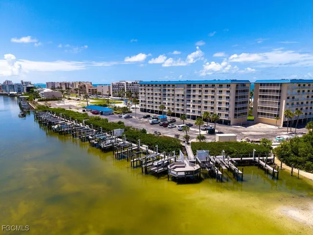 a view of a swimming pool with outdoor seating