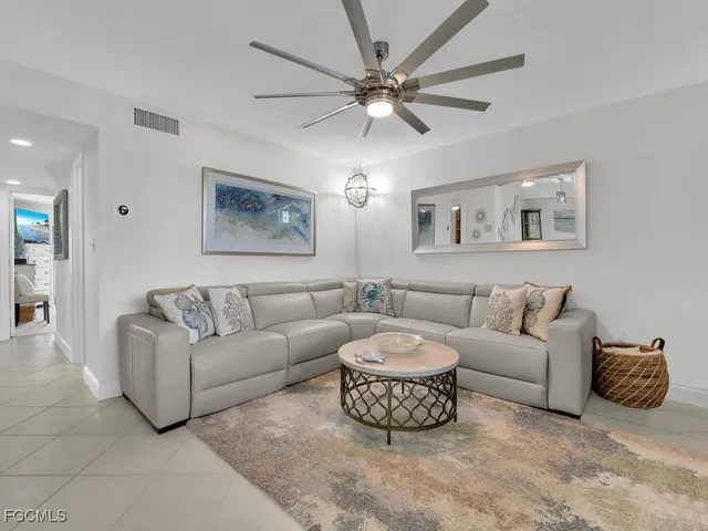 a living room with furniture a bed and a couch