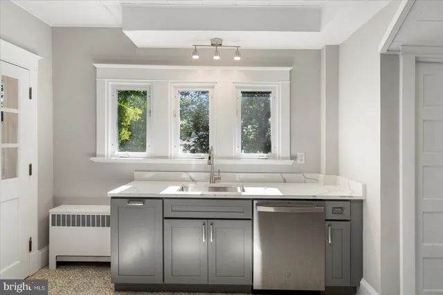 a bathroom with a sink and a window