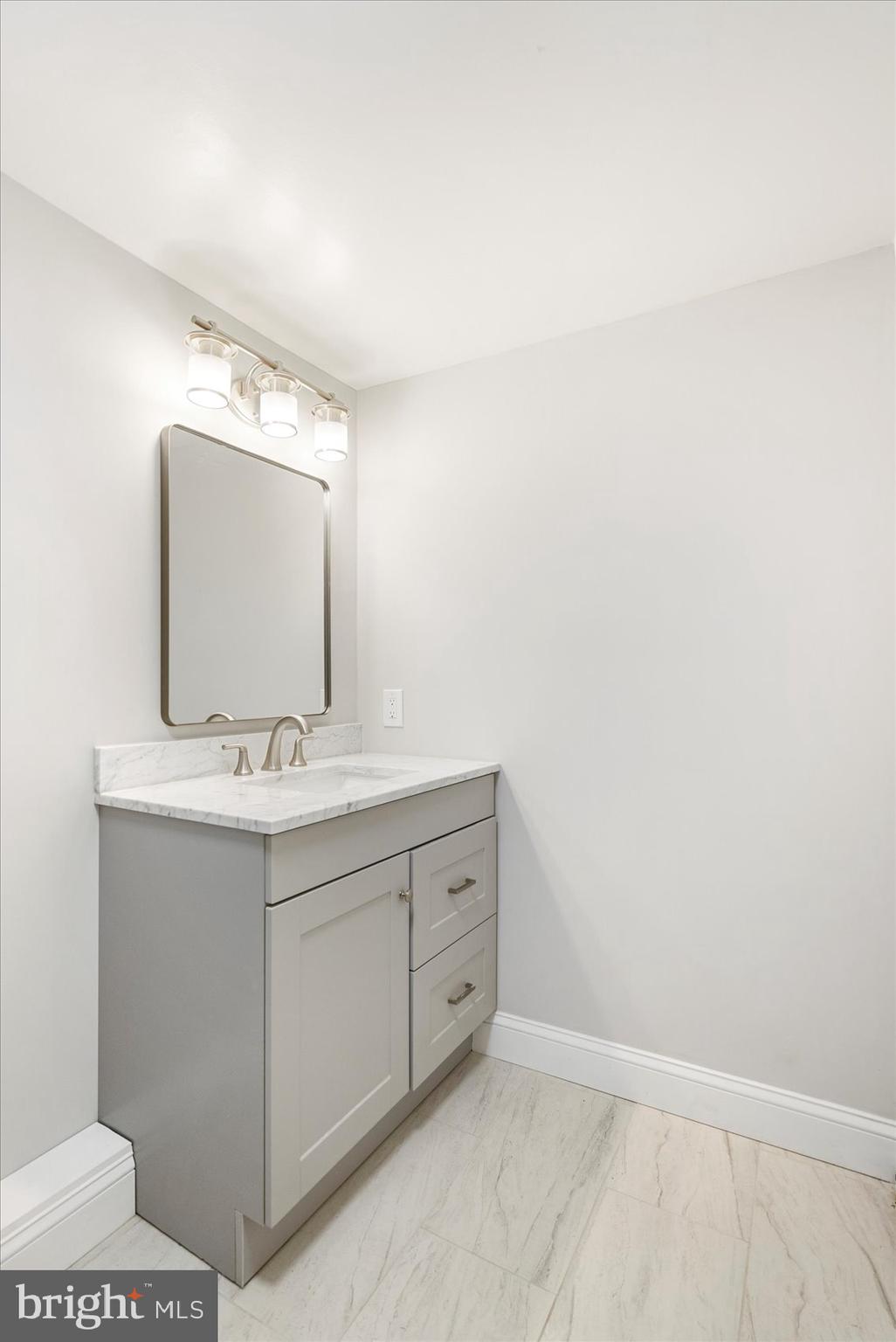 15317 York Road Sparks Glencoe, MD 21152 - Photo 18 of 47 a bathroom with a sink vanity and mirror