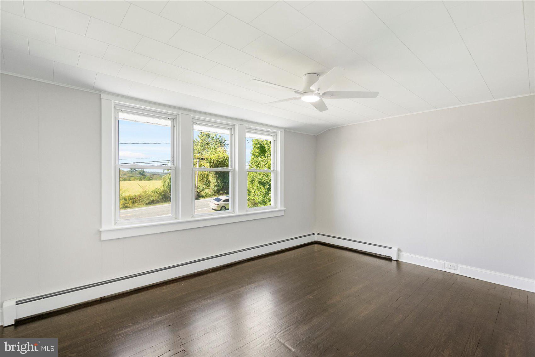 15317 York Road Sparks Glencoe, MD 21152 - Photo 24 of 47 an empty room with wooden floor and windows