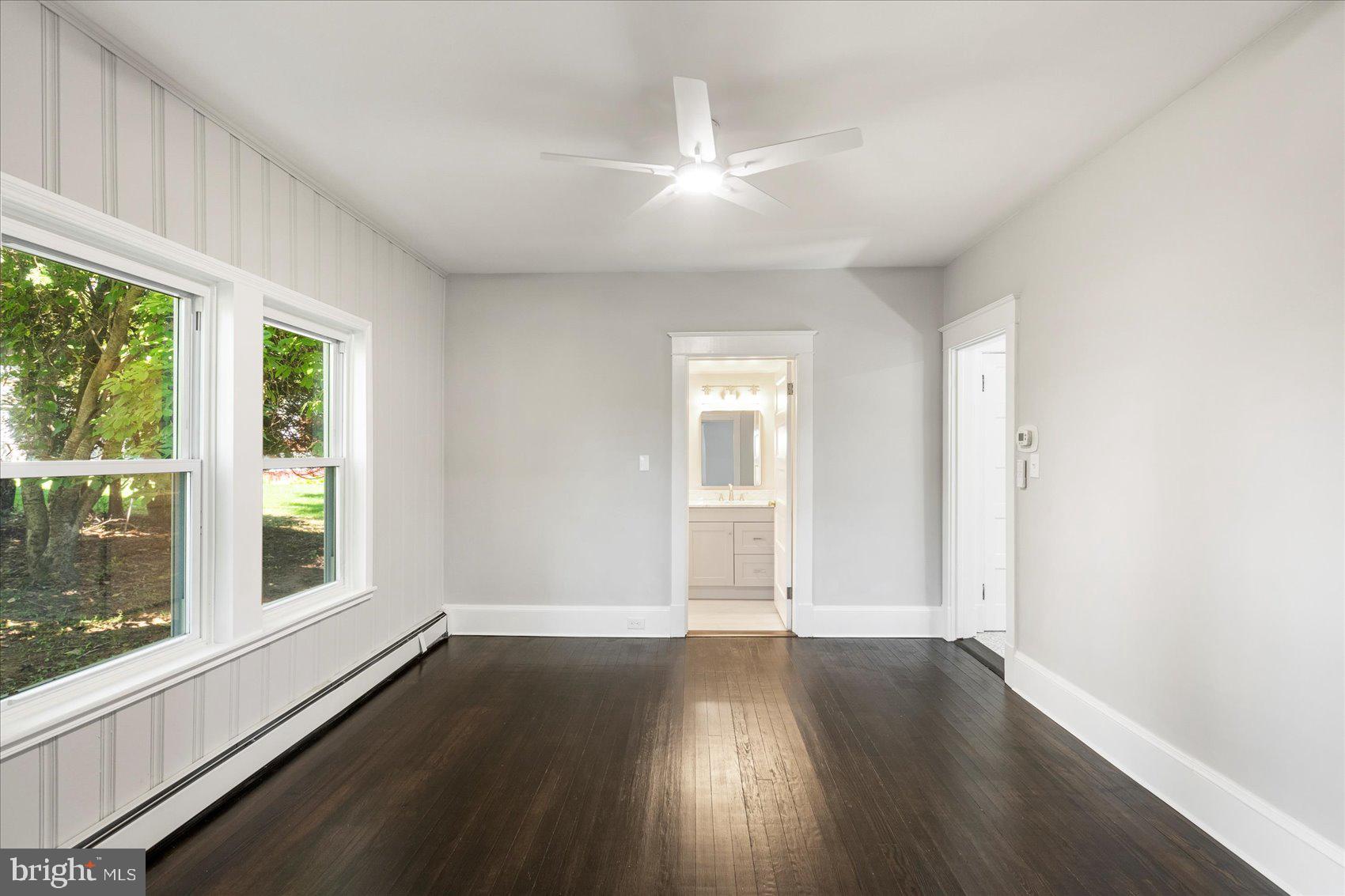 15317 York Road Sparks Glencoe, MD 21152 - Photo 7 of 47 an empty room with wooden floor and windows