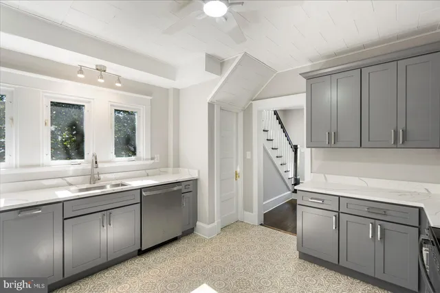 a kitchen with a sink and a refrigerator