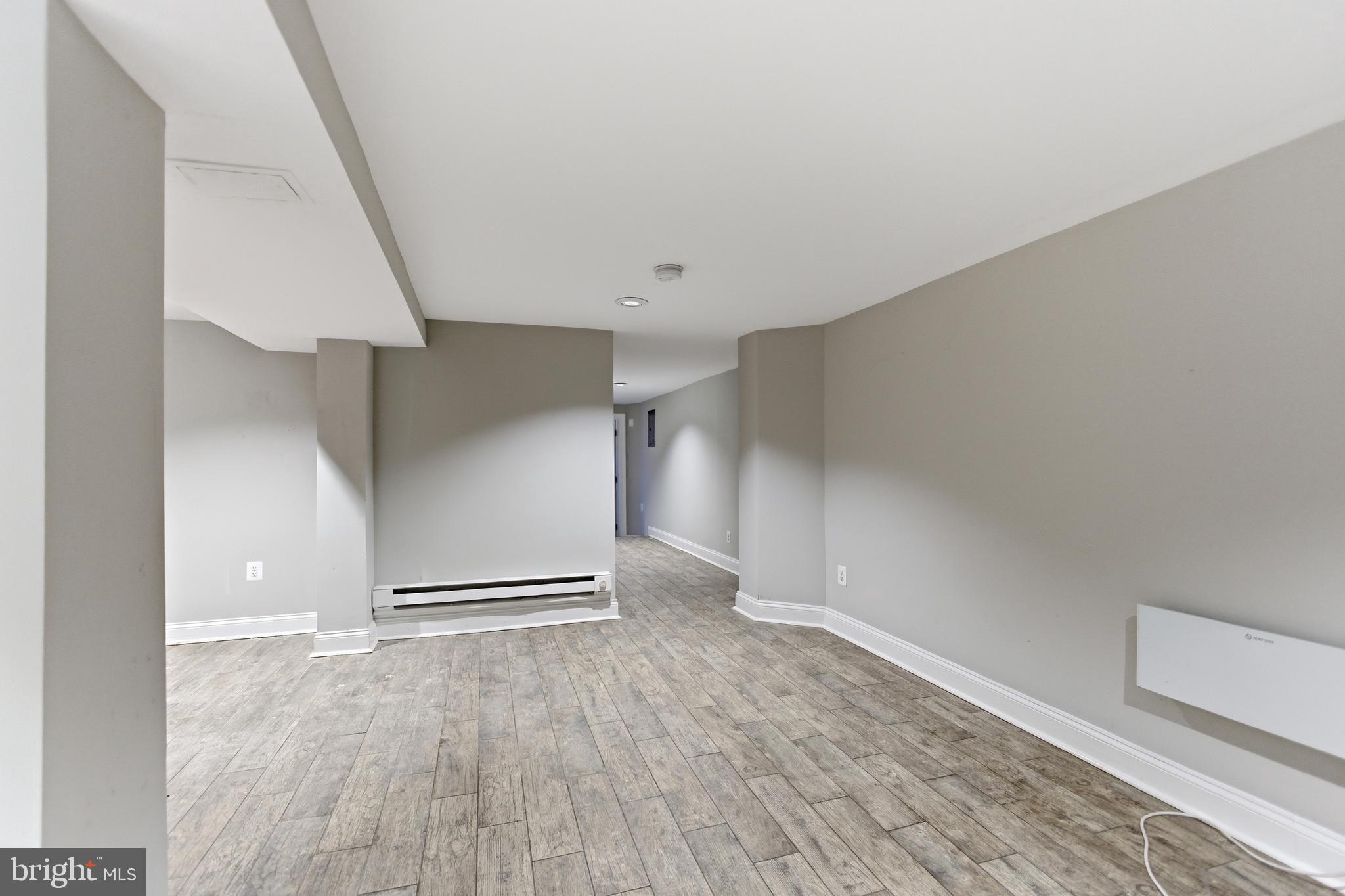 5518 13th Street Northwest, Unit B Washington, DC 20011 - Photo 4 of 8 a view of an empty room with wooden floor