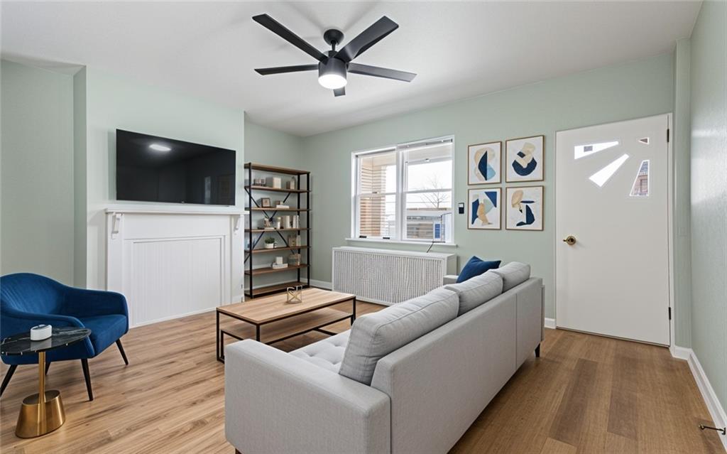 411 Edith Street Pittsburgh, PA 15211 - Photo 3 of 31 a living room with furniture and a flat screen tv