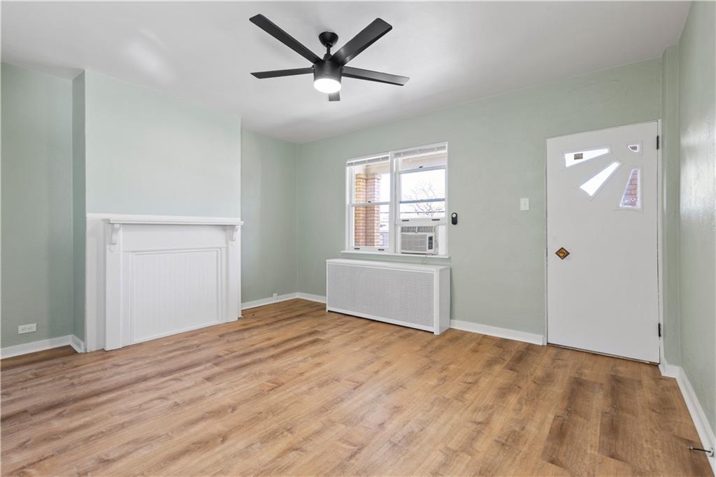 411 Edith Street Pittsburgh, PA 15211 - Photo 7 of 31 a view of a big room with wooden floor and windows