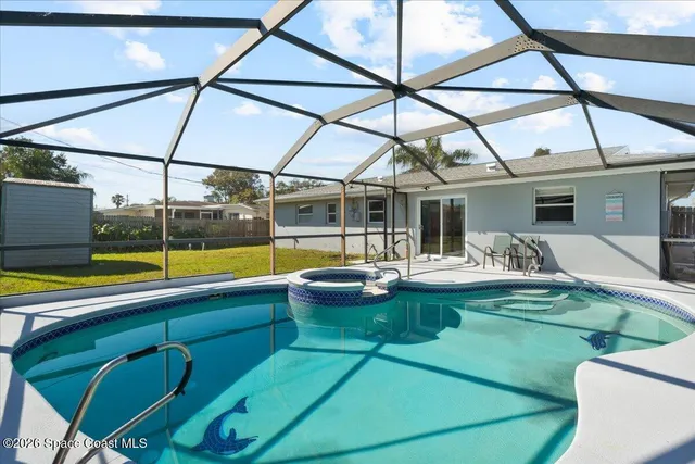 a view of swimming pool with seating area and furniture