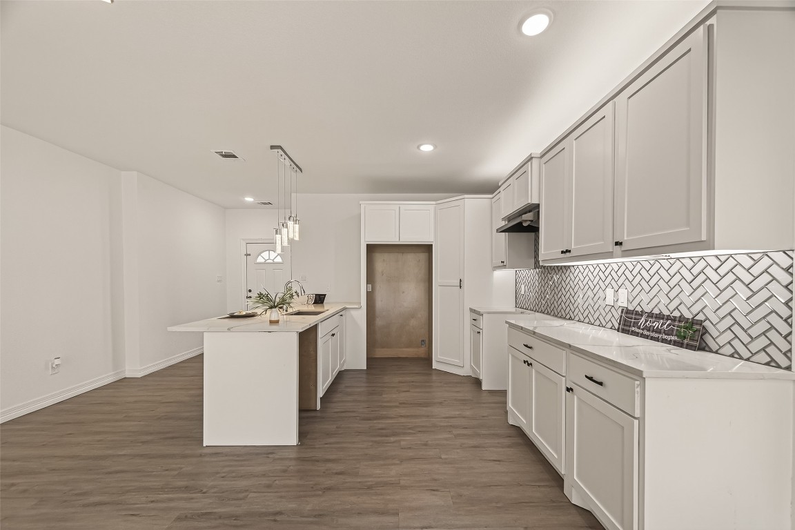 2609 Boss Street La Marque, TX 77568 - Photo 11 of 33 a kitchen with white cabinets appliances and sink