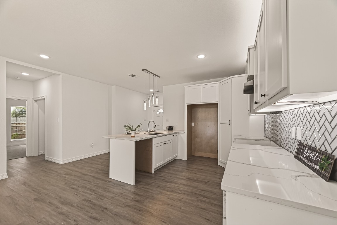 2609 Boss Street La Marque, TX 77568 - Photo 12 of 33 a kitchen with a refrigerator and a stove top oven