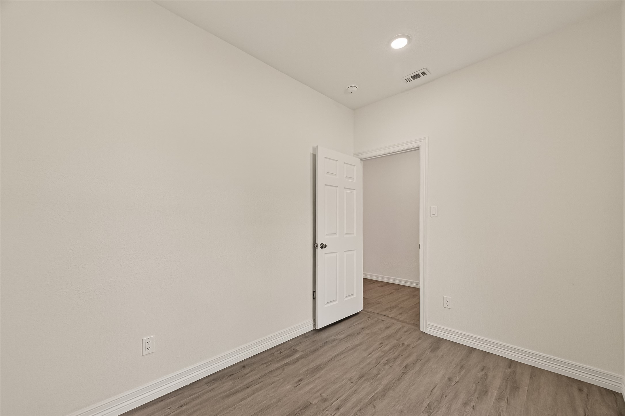 2609 Boss Street La Marque, TX 77568 - Photo 16 of 33 a view of an empty room with wooden floor