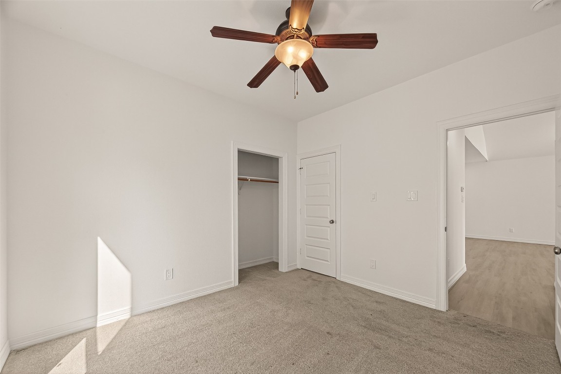 2609 Boss Street La Marque, TX 77568 - Photo 22 of 33 a view of a room with a ceiling fan and a window