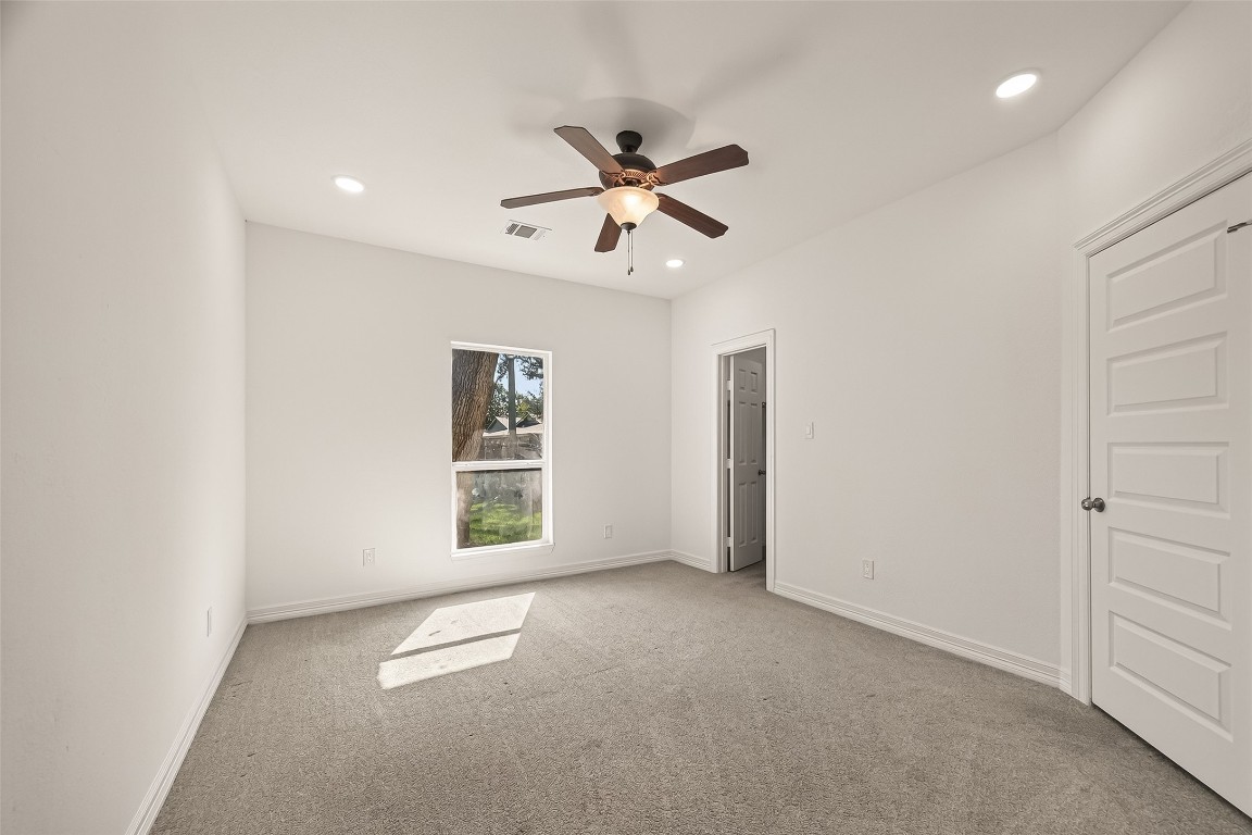2609 Boss Street La Marque, TX 77568 - Photo 24 of 33 an empty room with windows and ceiling fan