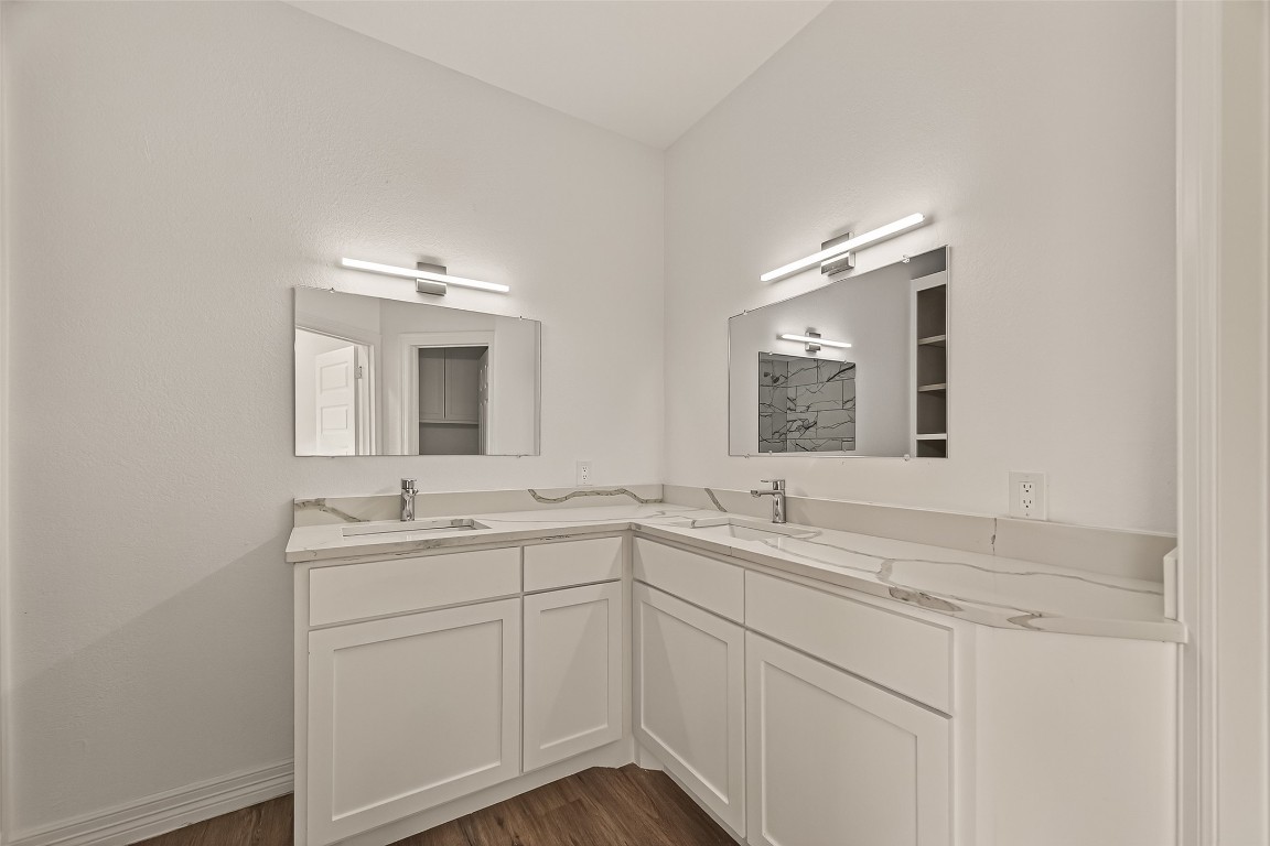 2609 Boss Street La Marque, TX 77568 - Photo 27 of 33 a bathroom with a sink and a mirror