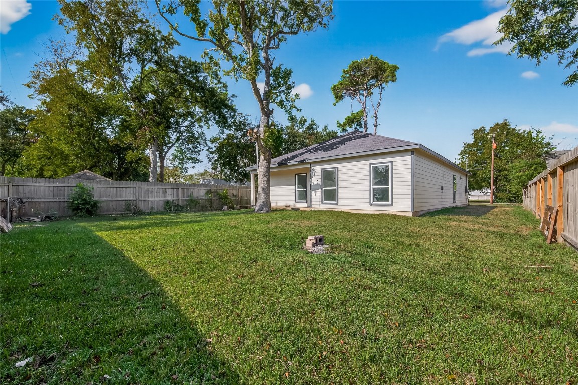 2609 Boss Street La Marque, TX 77568 - Photo 29 of 33 a view of a house with backyard and a tree
