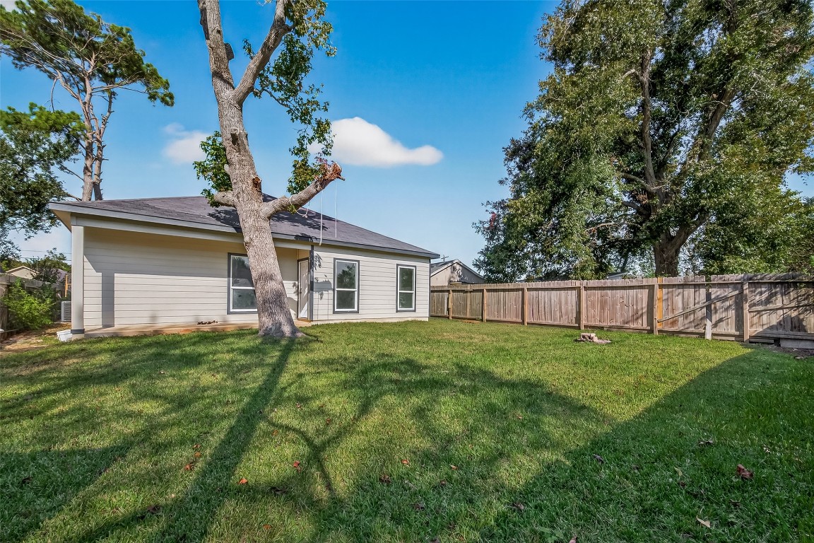 2609 Boss Street La Marque, TX 77568 - Photo 31 of 33 a view of a backyard with plants and garden