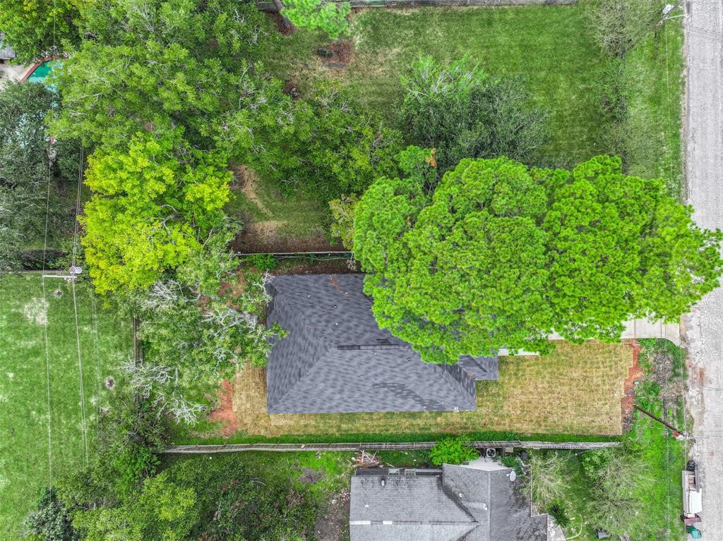 2609 Boss Street La Marque, TX 77568 - Photo 32 of 33 a view of a garden with plants and large trees