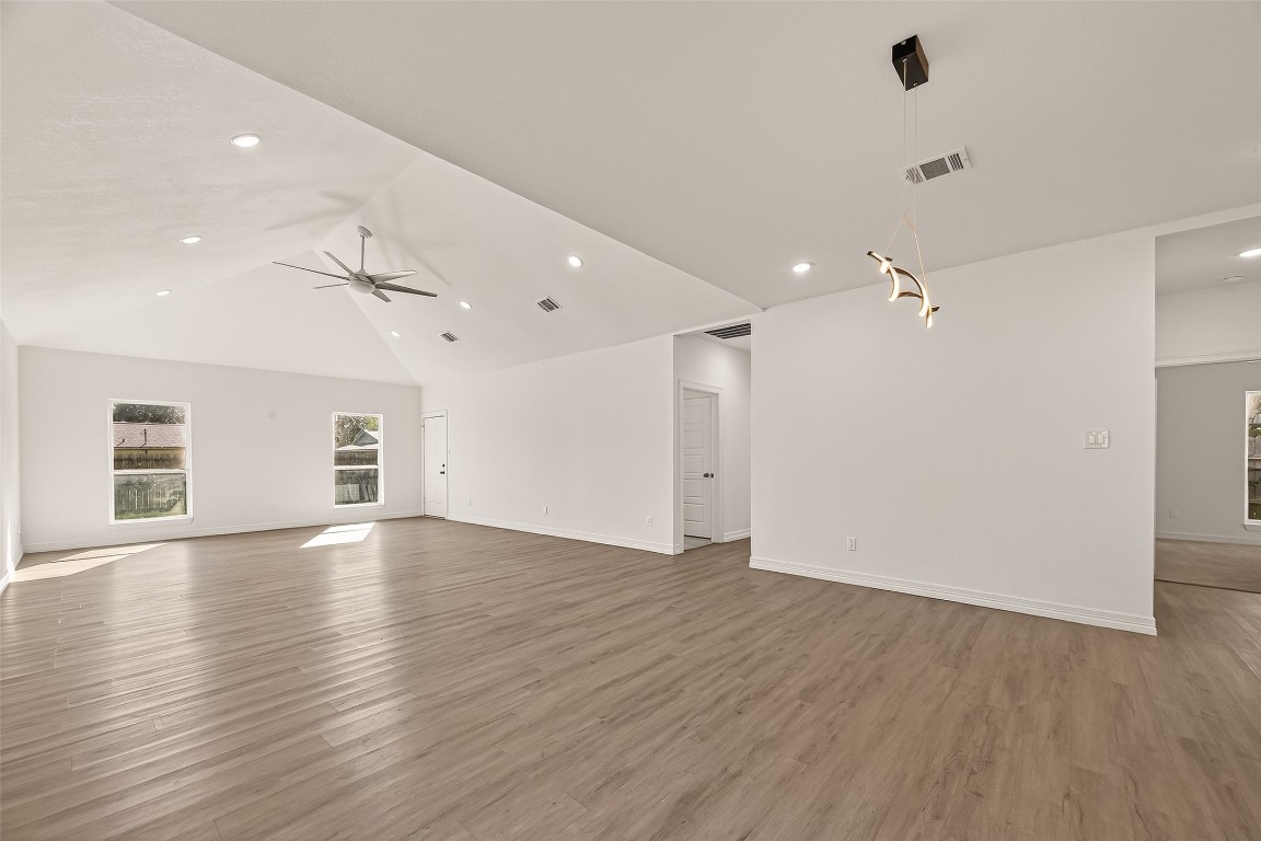 2609 Boss Street La Marque, TX 77568 - Photo 4 of 33 an empty room with wooden floor and windows