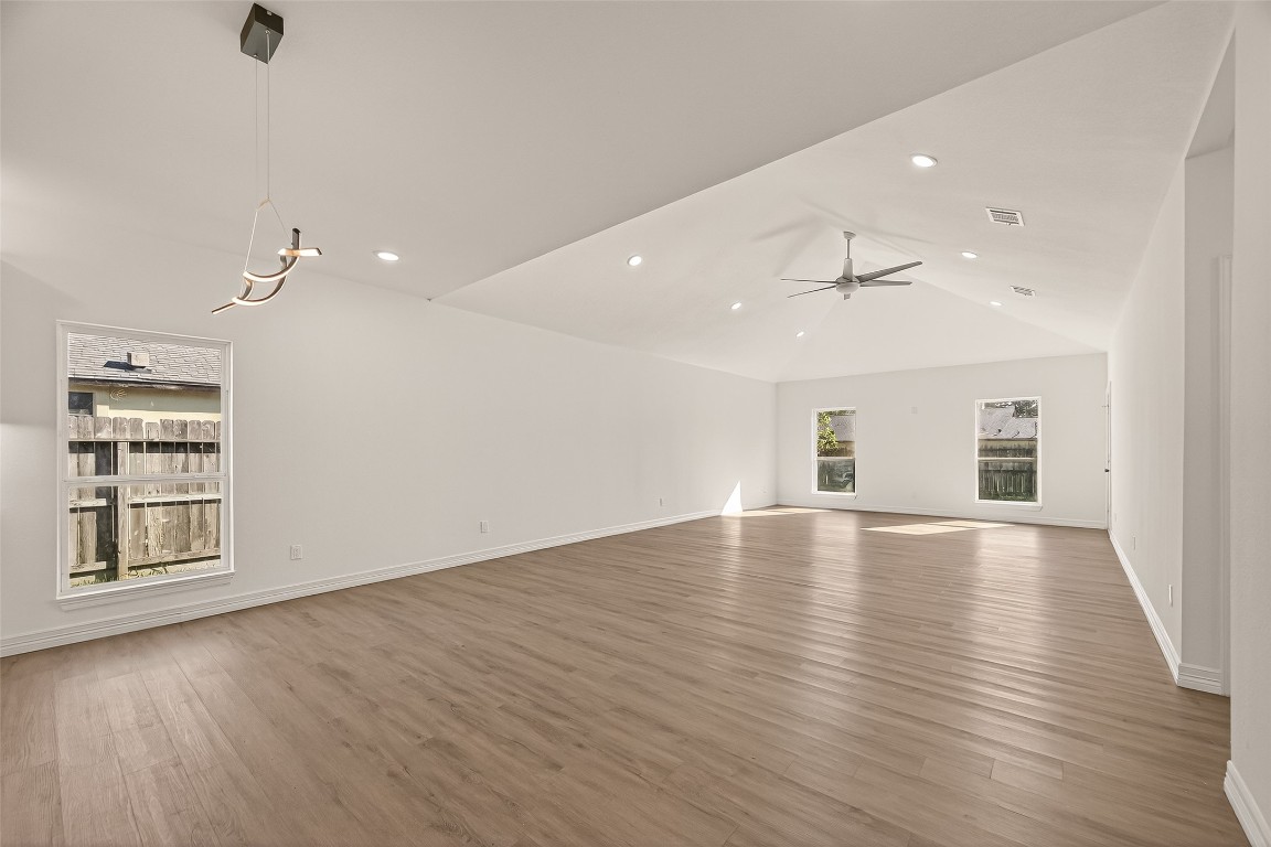 2609 Boss Street La Marque, TX 77568 - Photo 5 of 33 an empty room with wooden floor and windows