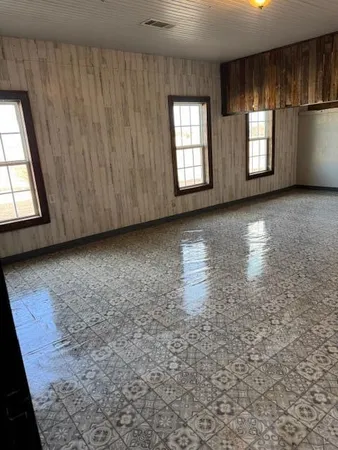 an empty room with windows