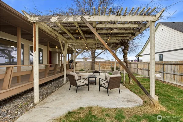 a view of a house with backyard porch and sitting area