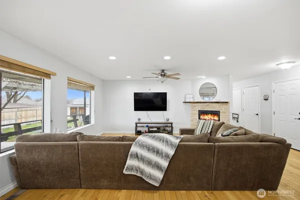 a living room with furniture and a flat screen tv