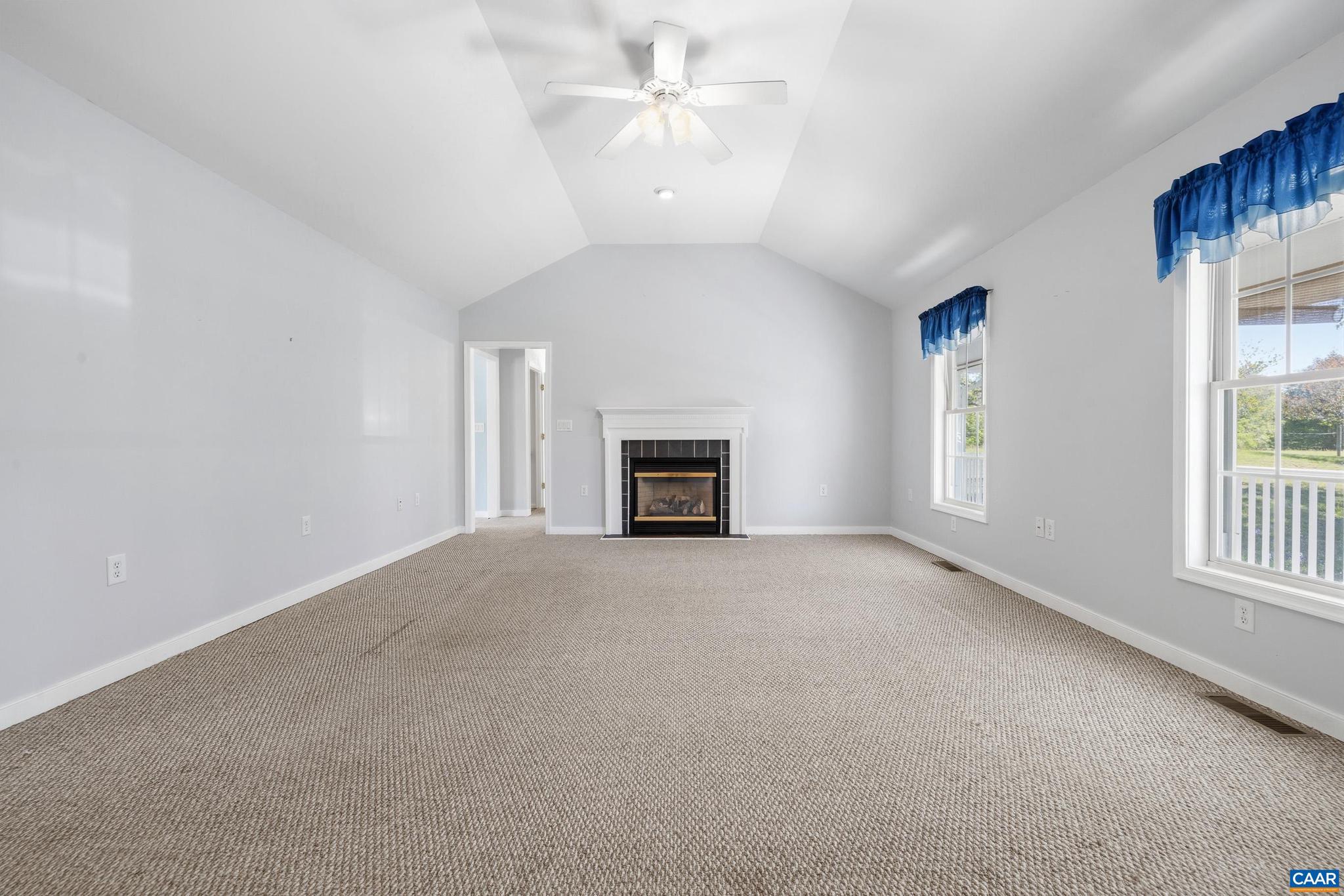 1075 Social Hall Road New Canton, VA 23123 - Photo 44 of 64 a view of a livingroom with a fireplace and a window