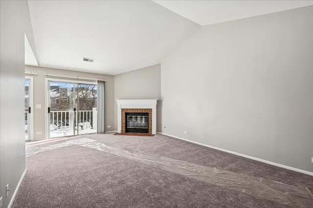 an empty room with fireplace