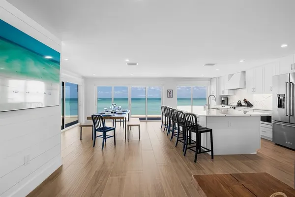 a kitchen with a table and chairs in it