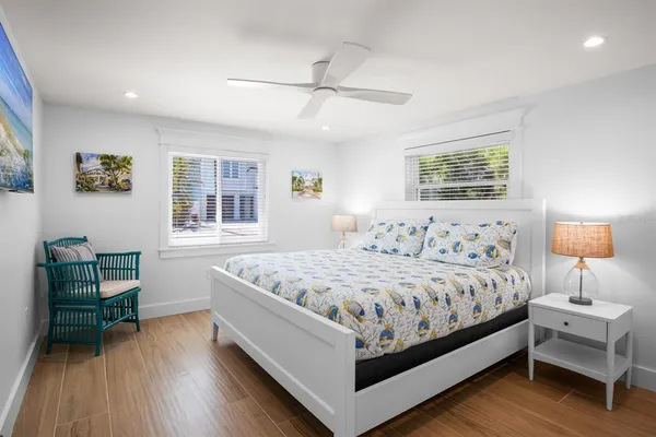 a bedroom with a bed and a table