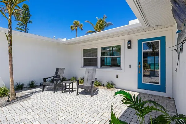 a view of a chairs and table in a patio