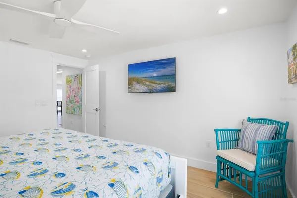 a bedroom with a bed and a couch