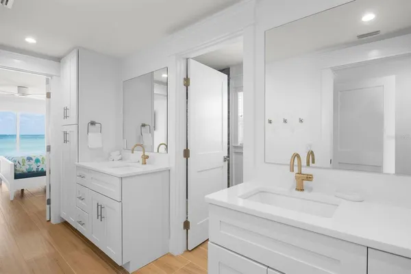 a bathroom with a sink a mirror and a shower