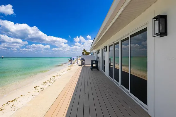 a view of a balcony with hardwood