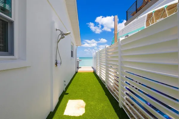 a view of a backyard with sitting area