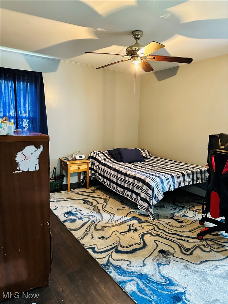 418 Main Street Philo, OH 43771 - Photo 11 of 37 Bedroom with wood finished floors and ceiling fan