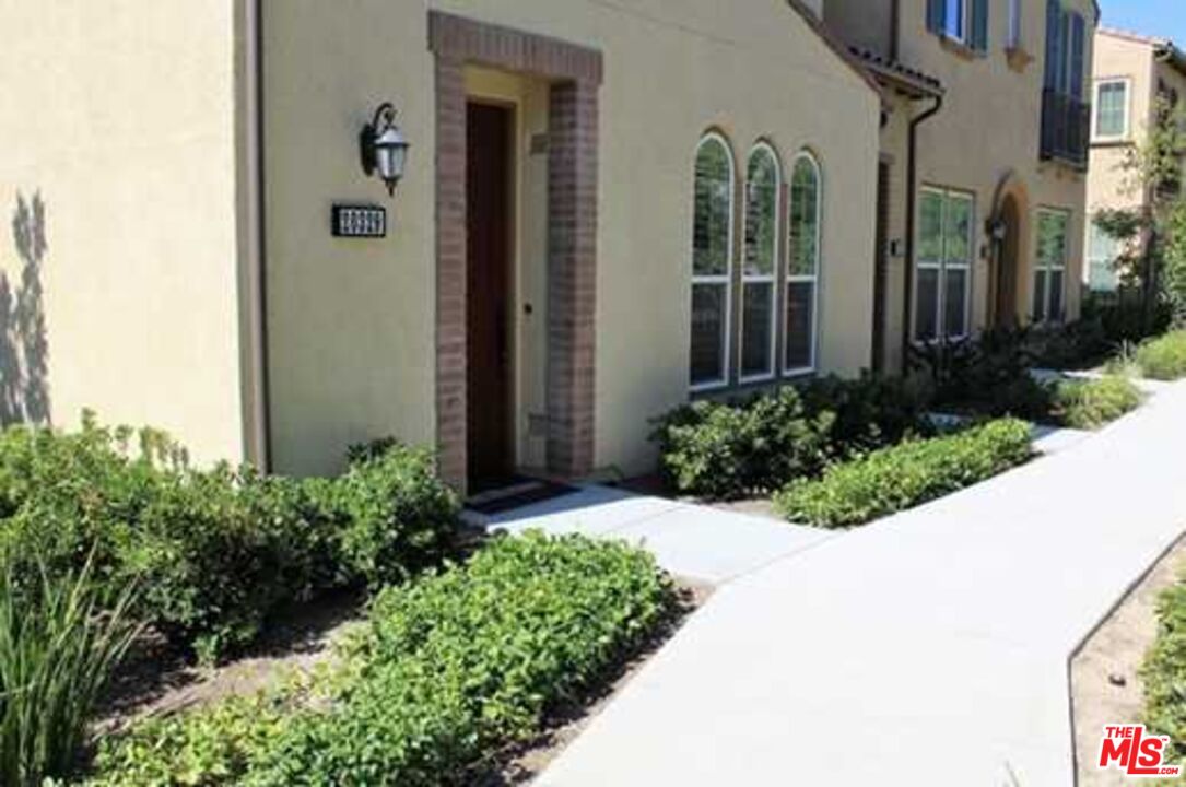 20329 Paseo Los Arcos Porter Ranch, CA 91326 - Photo 1 of 22 front view of a house with a yard