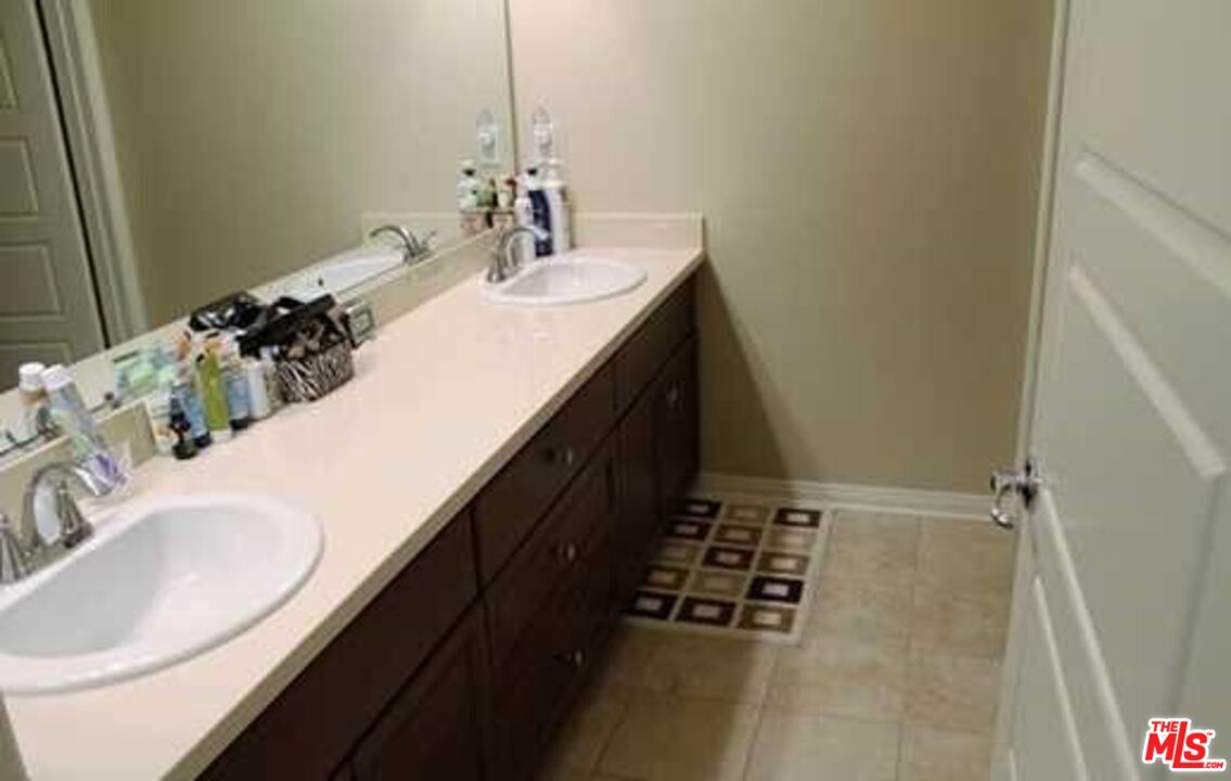 20329 Paseo Los Arcos Porter Ranch, CA 91326 - Photo 11 of 22 a bathroom with a sink and a mirror