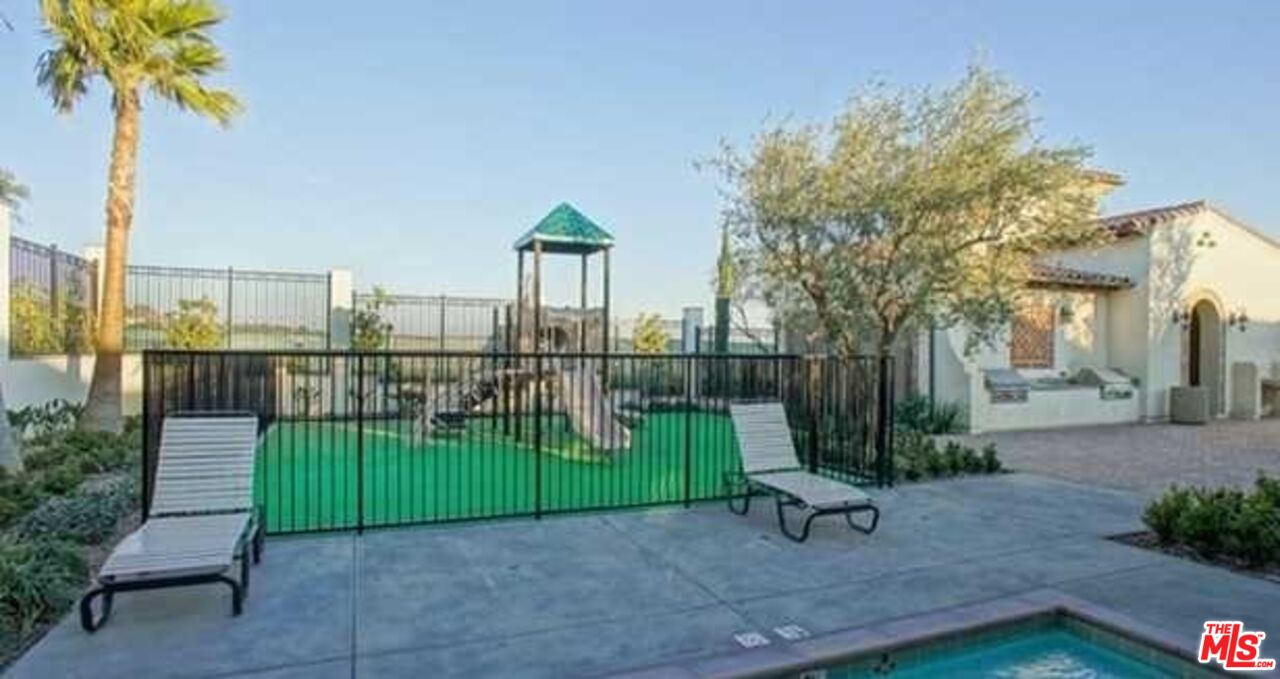 20329 Paseo Los Arcos Porter Ranch, CA 91326 - Photo 18 of 22 a view of a park with iron fence