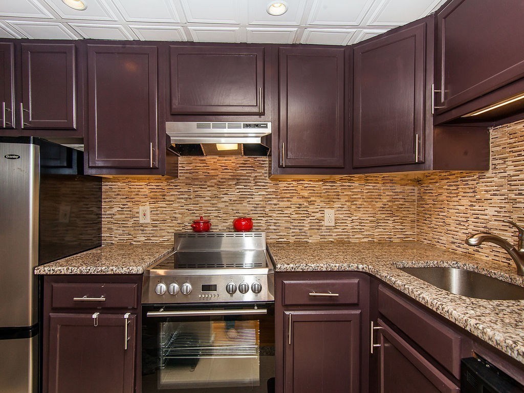 464 Commonwealth Avenue, Unit 36 Boston, MA 02215 - Photo 2 of 18 a kitchen with granite countertop stainless steel appliances and cabinets