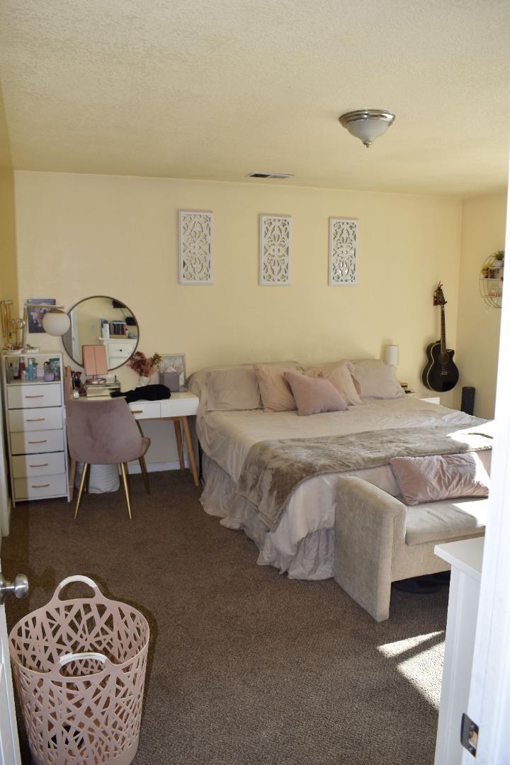 359 North 3rd Street Grover Beach, CA 93433 - Photo 11 of 23 a bedroom with a bed and a table