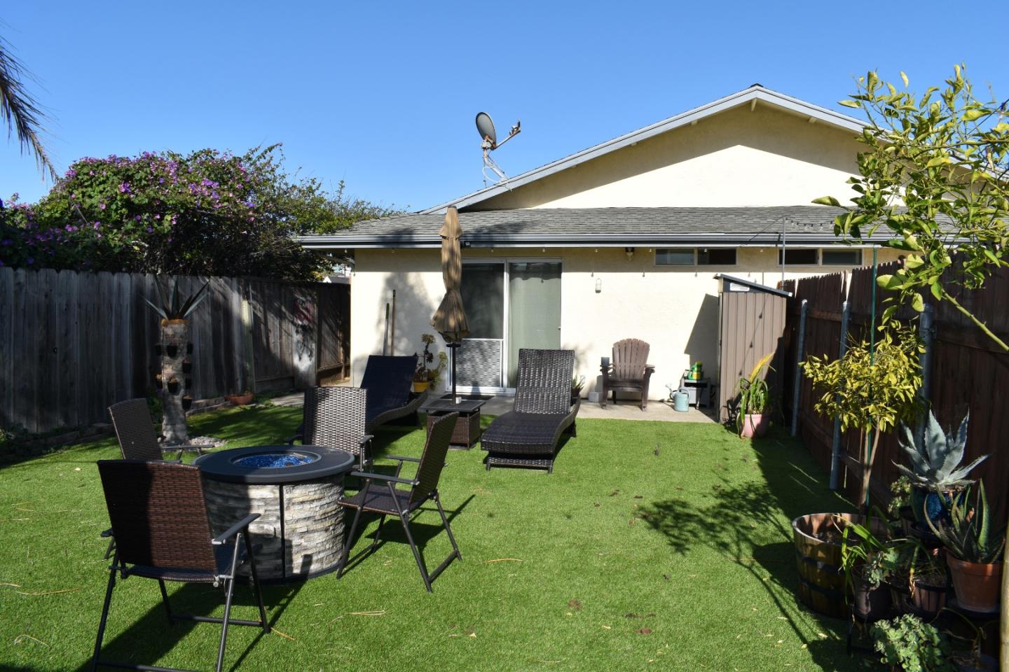 359 North 3rd Street Grover Beach, CA 93433 - Photo 15 of 23 a view of a backyard with plants and a patio