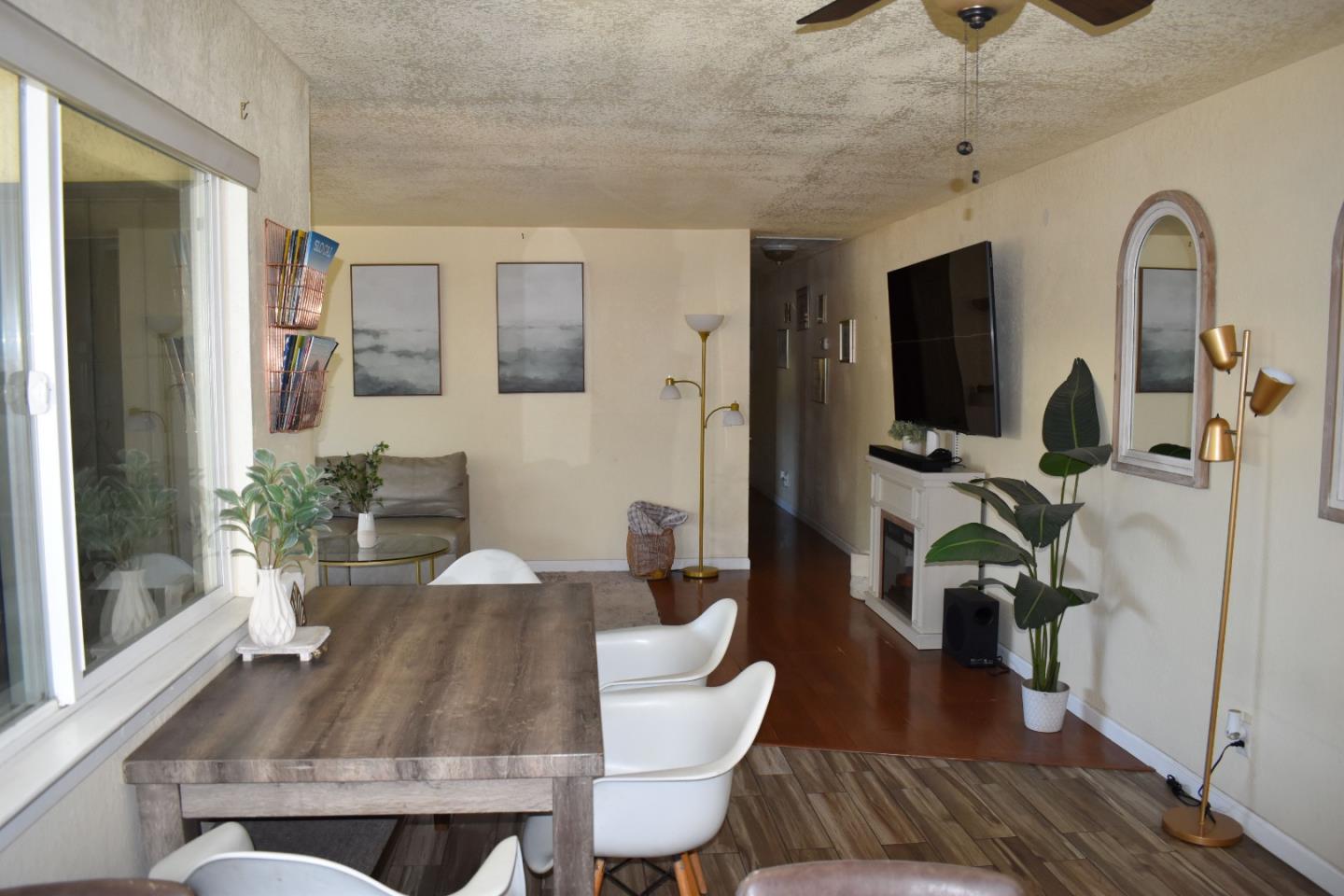 359 North 3rd Street Grover Beach, CA 93433 - Photo 21 of 23 a view of a dining room with furniture a chandelier and wooden floor