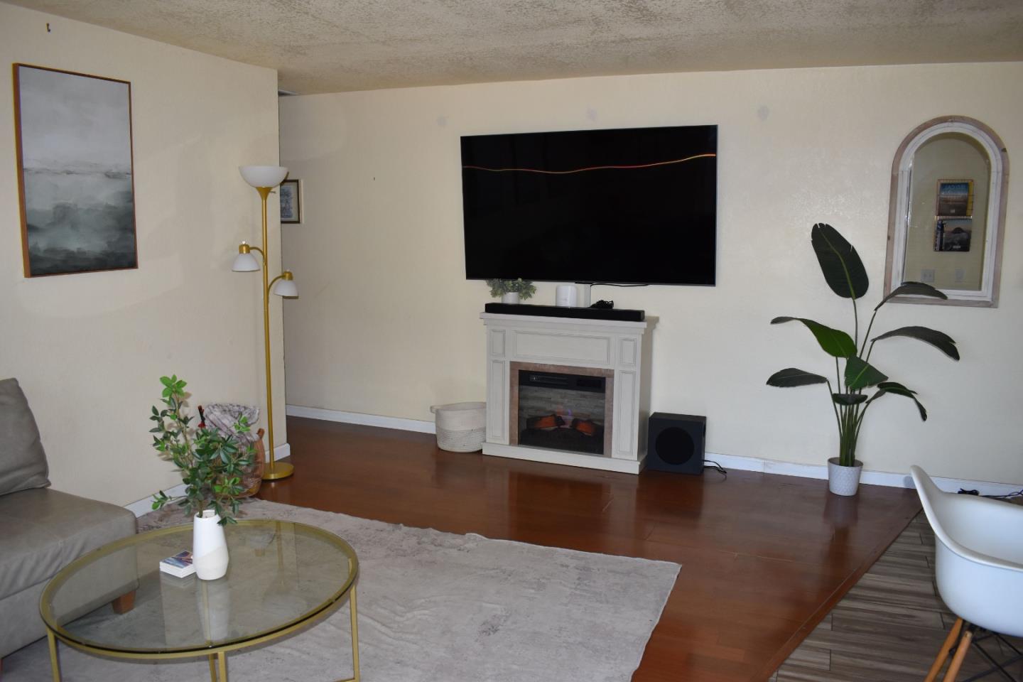 359 North 3rd Street Grover Beach, CA 93433 - Photo 23 of 23 a living room with furniture fireplace and a flat screen tv