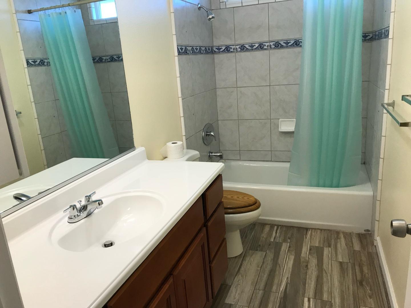 359 North 3rd Street Grover Beach, CA 93433 - Photo 9 of 10 a bathroom with a sink a toilet and shower