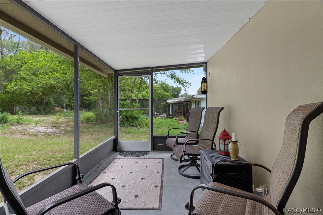 3355 South Highlands Avenue Inverness, FL 34452 - Photo 25 of 30 a view of a workspace with lounge chair and windows