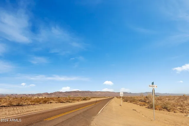 a view of an ocean beach and mountain