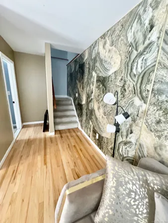 a view of wooden floor and chair in a room
